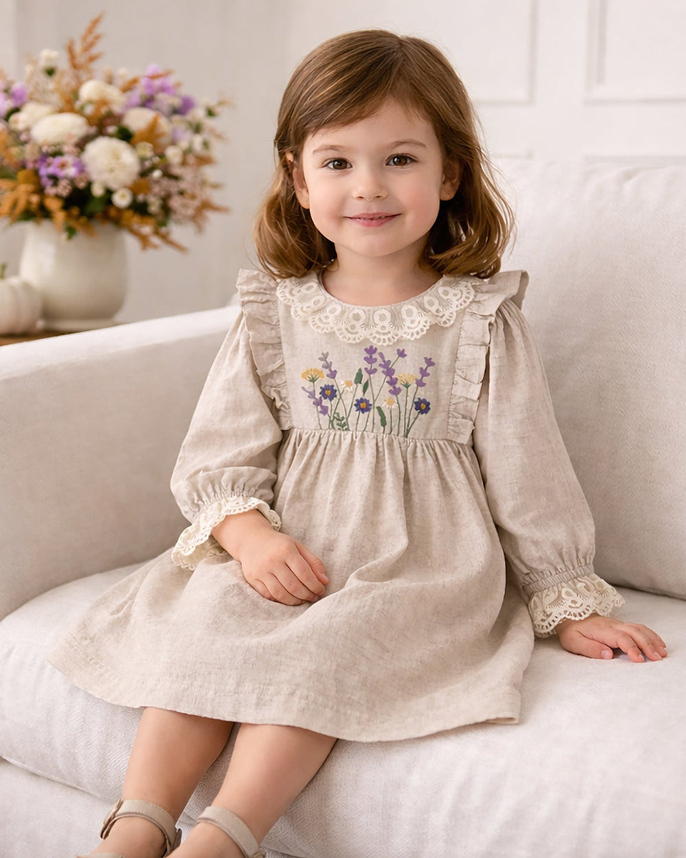 Beige linen dress with embroidered wildflowers and lace collar and sleeve cuffs