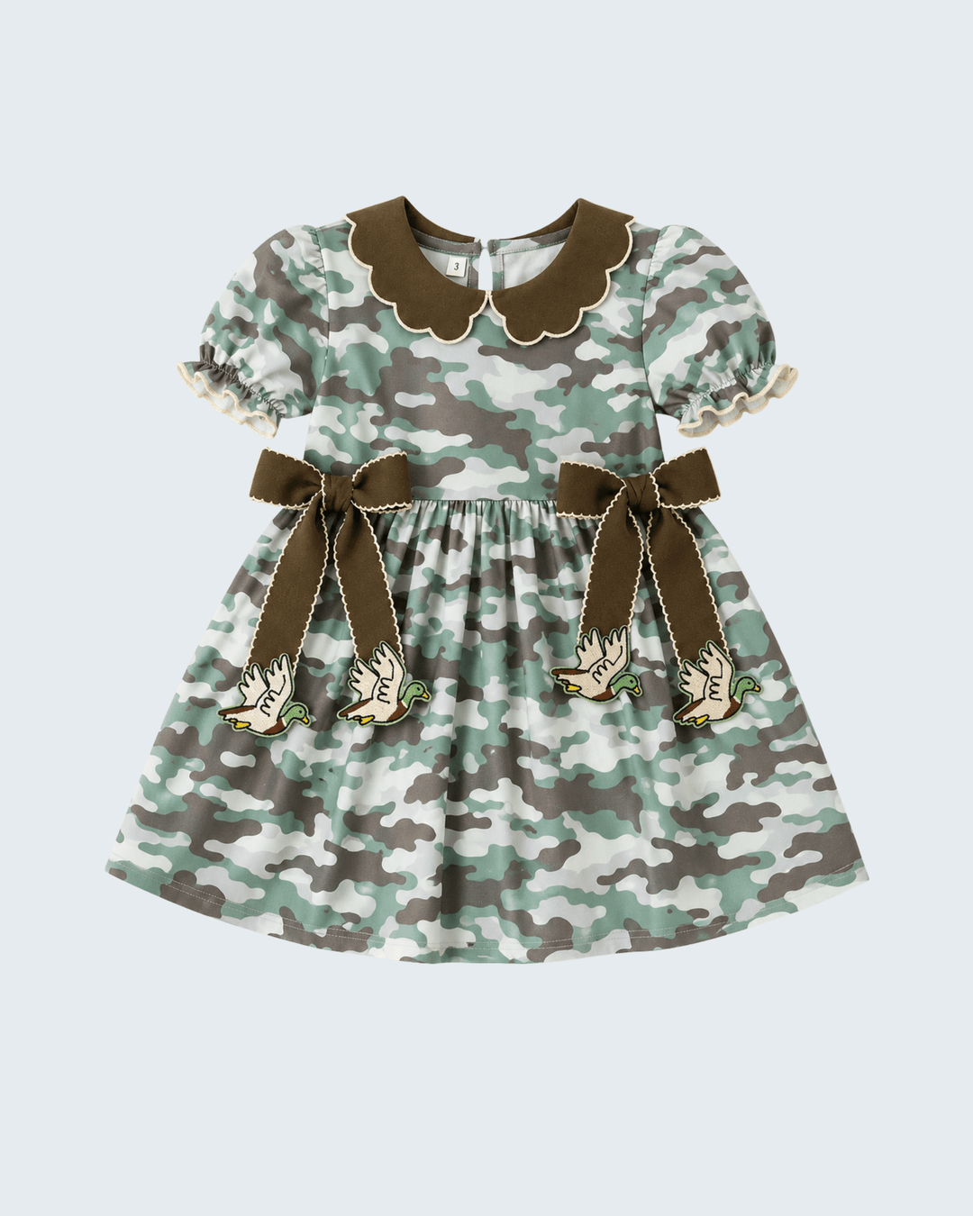 Camouflage twirl dress with puff sleeves, scalloped brown collar, bow-tied waist