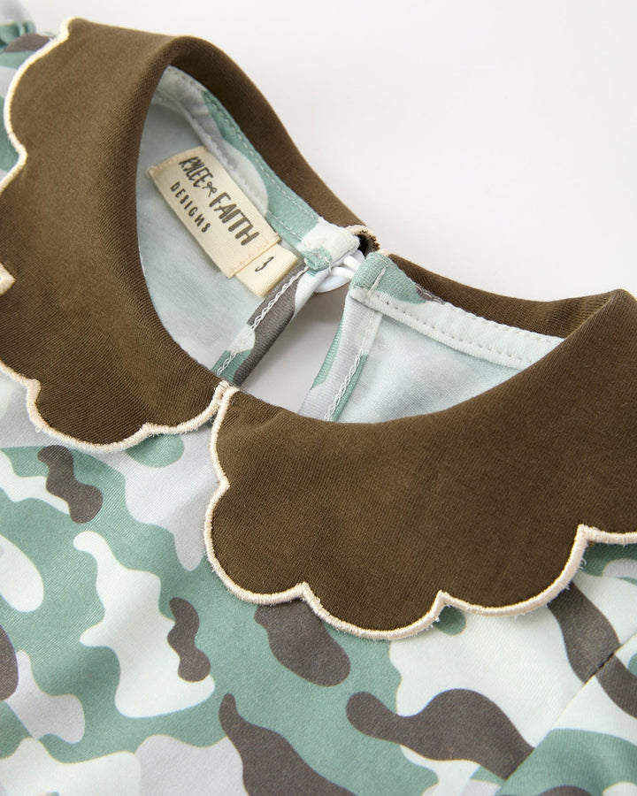 Camo dress neckline closeup with brown scalloped Peter Pan collar trim