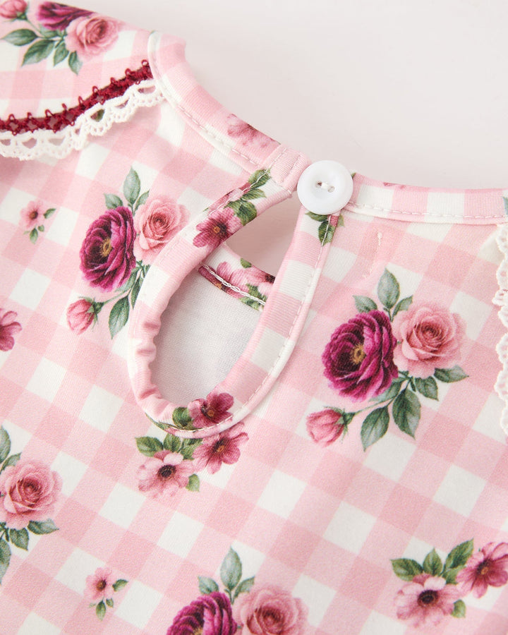 Toddler dress neckline close-up with keyhole button and pink floral gingham print