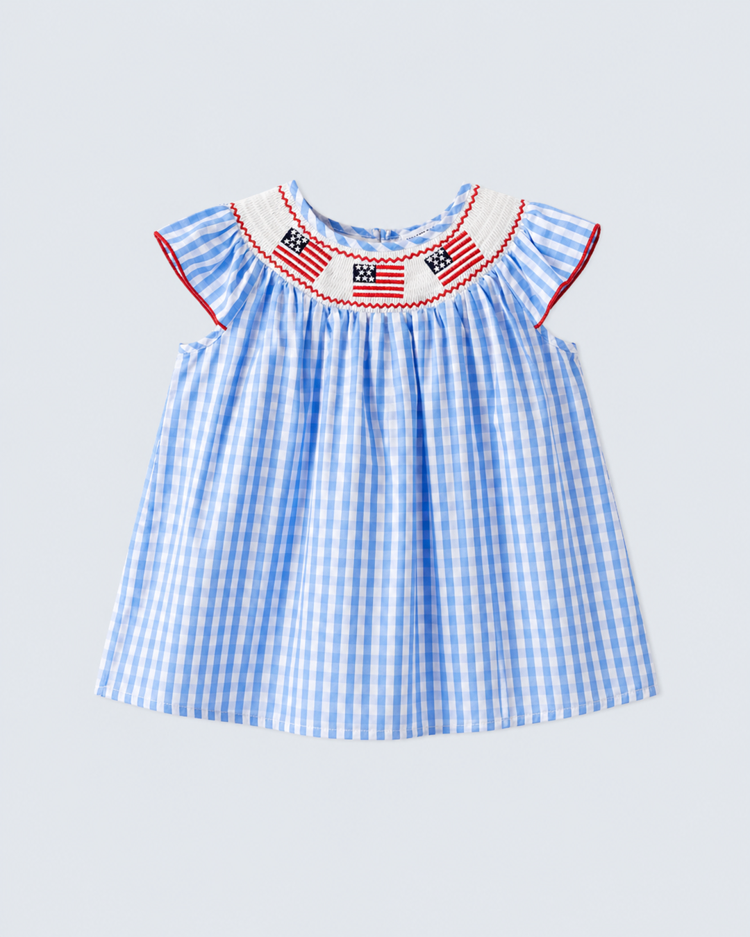 Blue and white checkered dress with American flag details on a light gray background