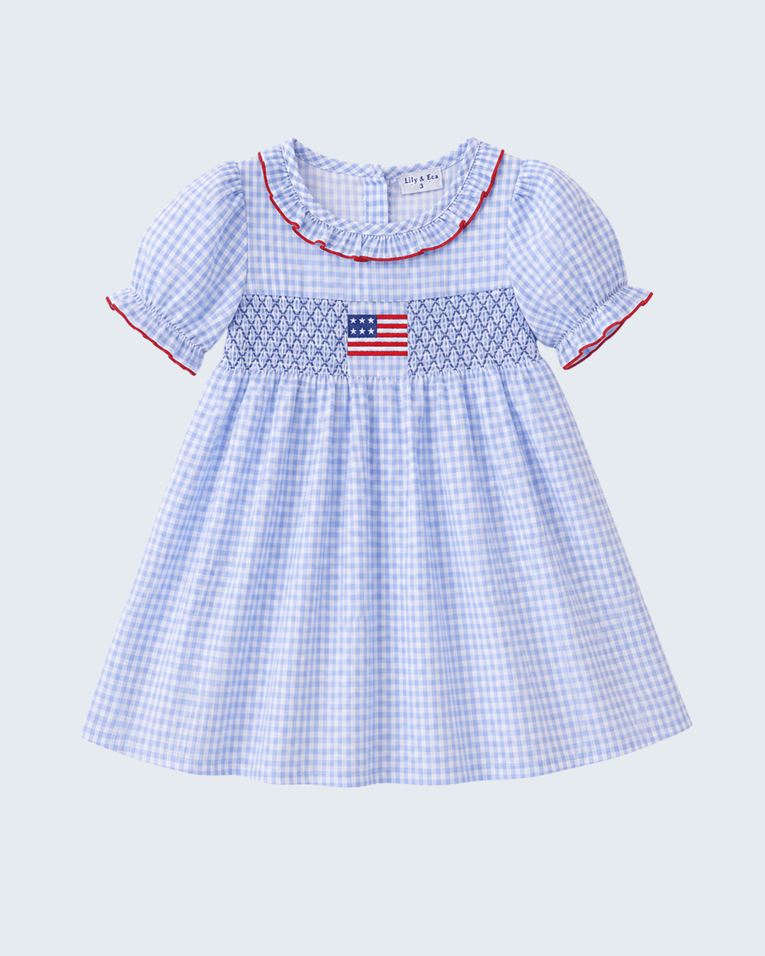 Girls blue dress with embroidered flag