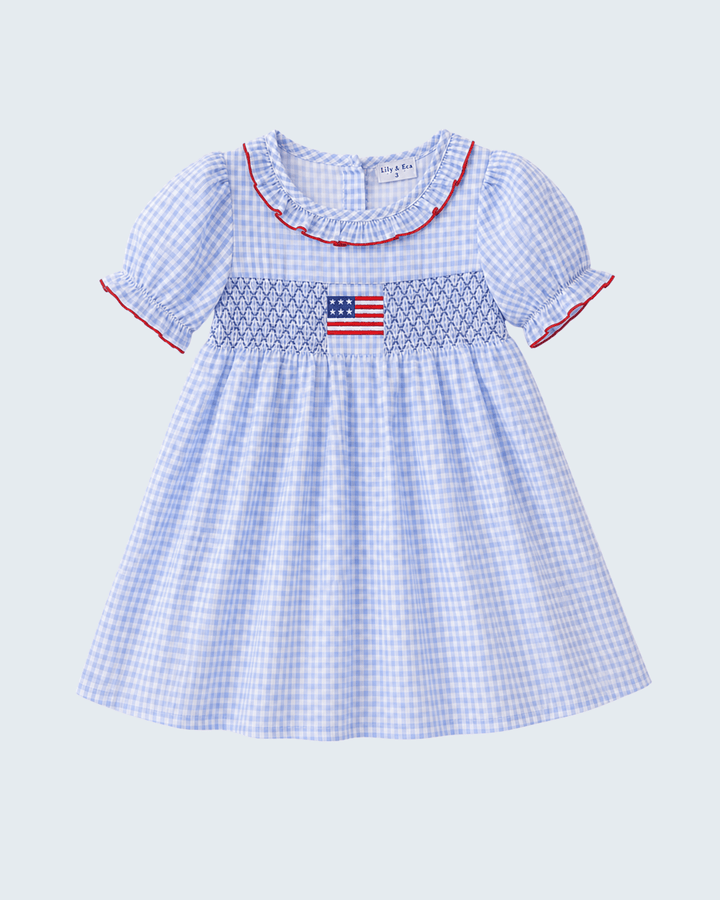 Girls blue dress with embroidered flag