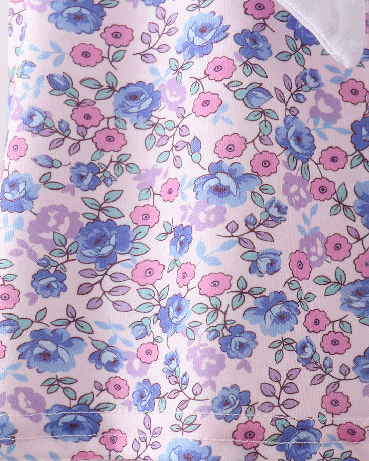 Floral patterned fabric with blue and pink flowers on a light background