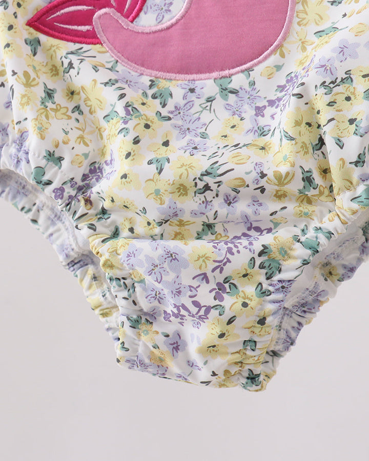 Floral swimsuit bottoms for girls on grey background