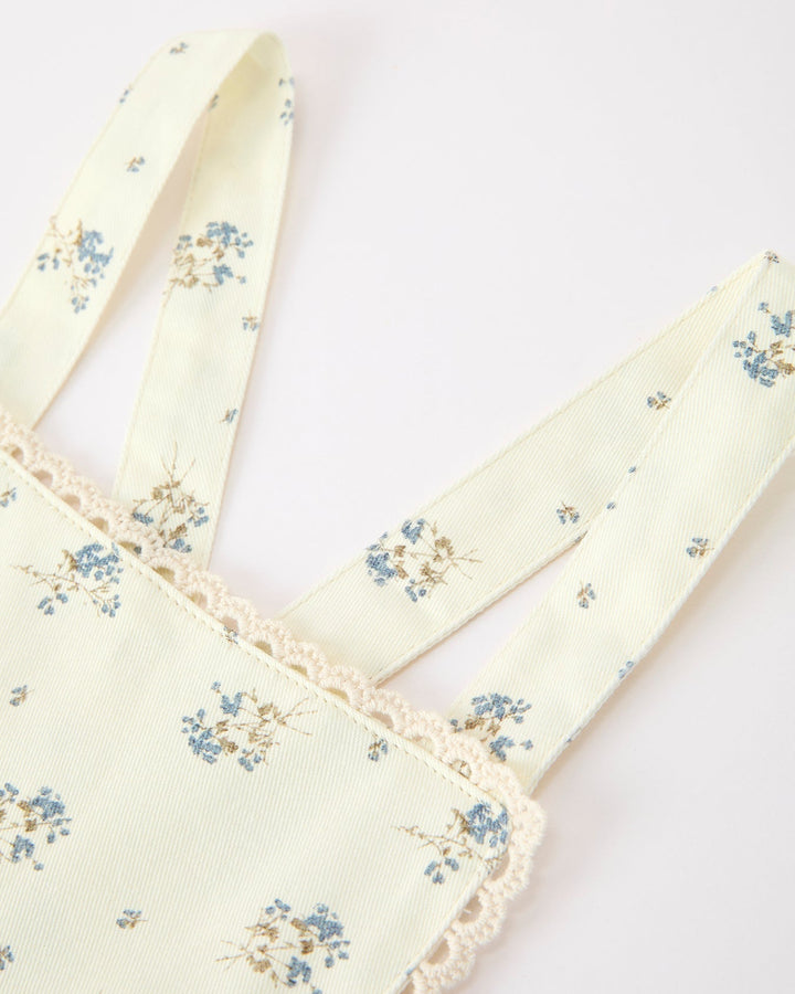 Floral-patterned jumpsuit on a white background