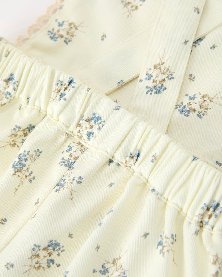 Floral patterned fabric with blue flowers on a white background