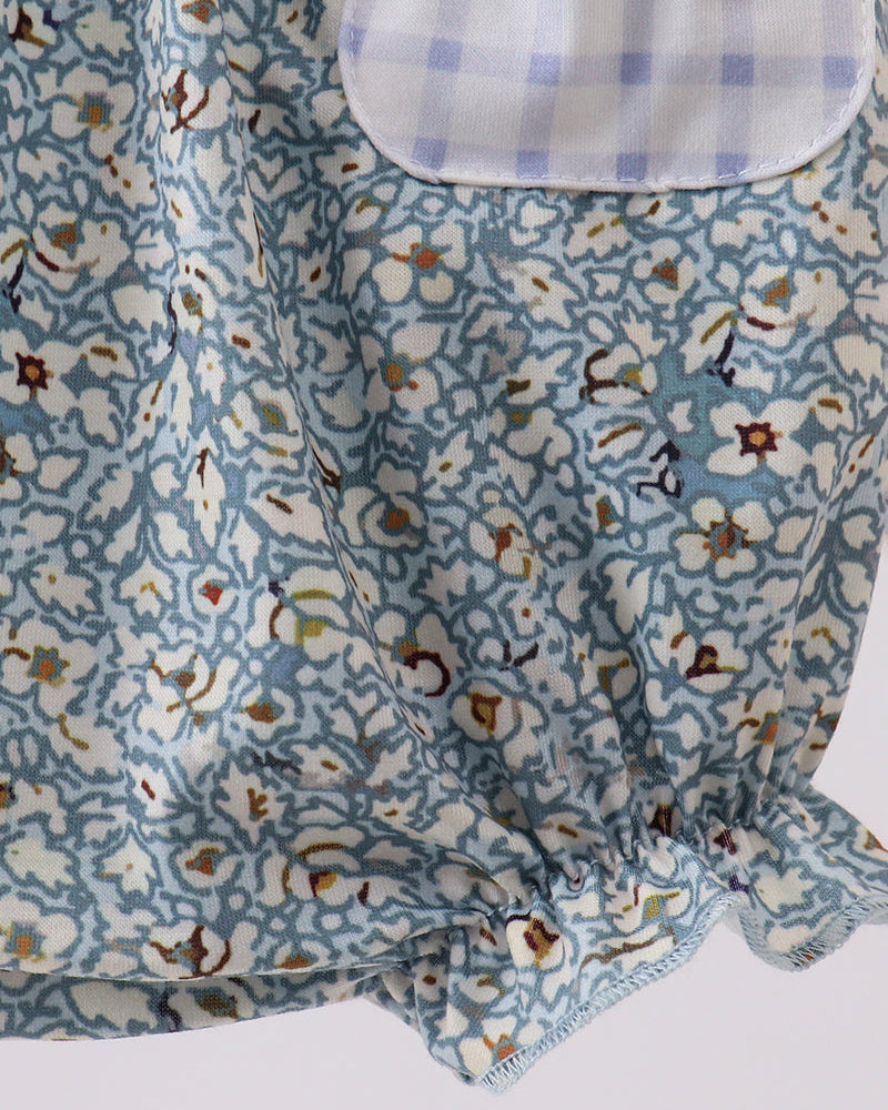 Floral romper with gingham pocket. 