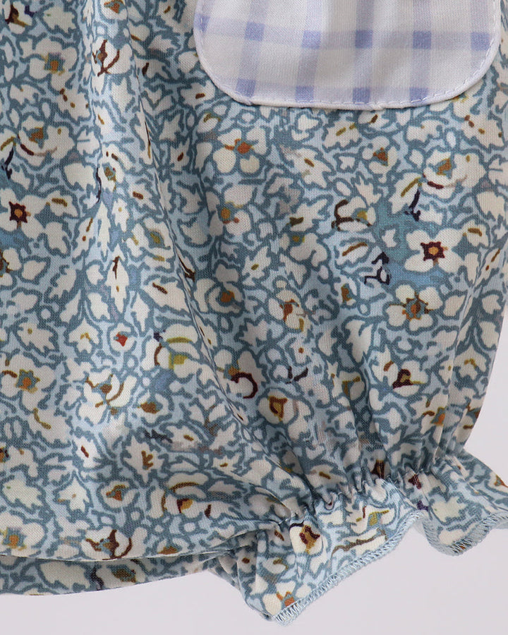 Floral romper with gingham pocket. 