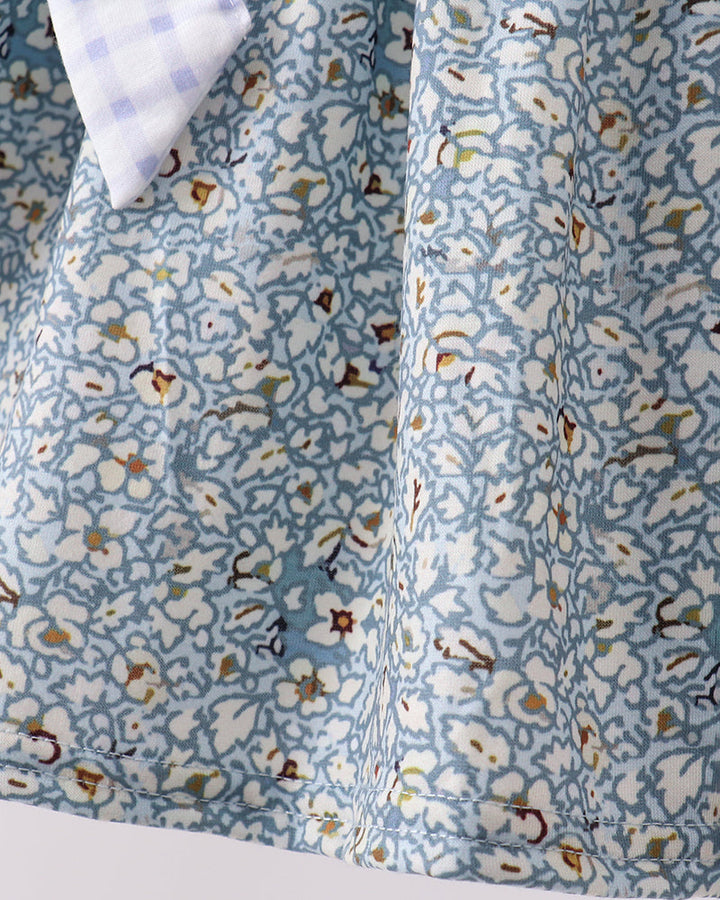 Close-up of a blue floral fabric with a white background