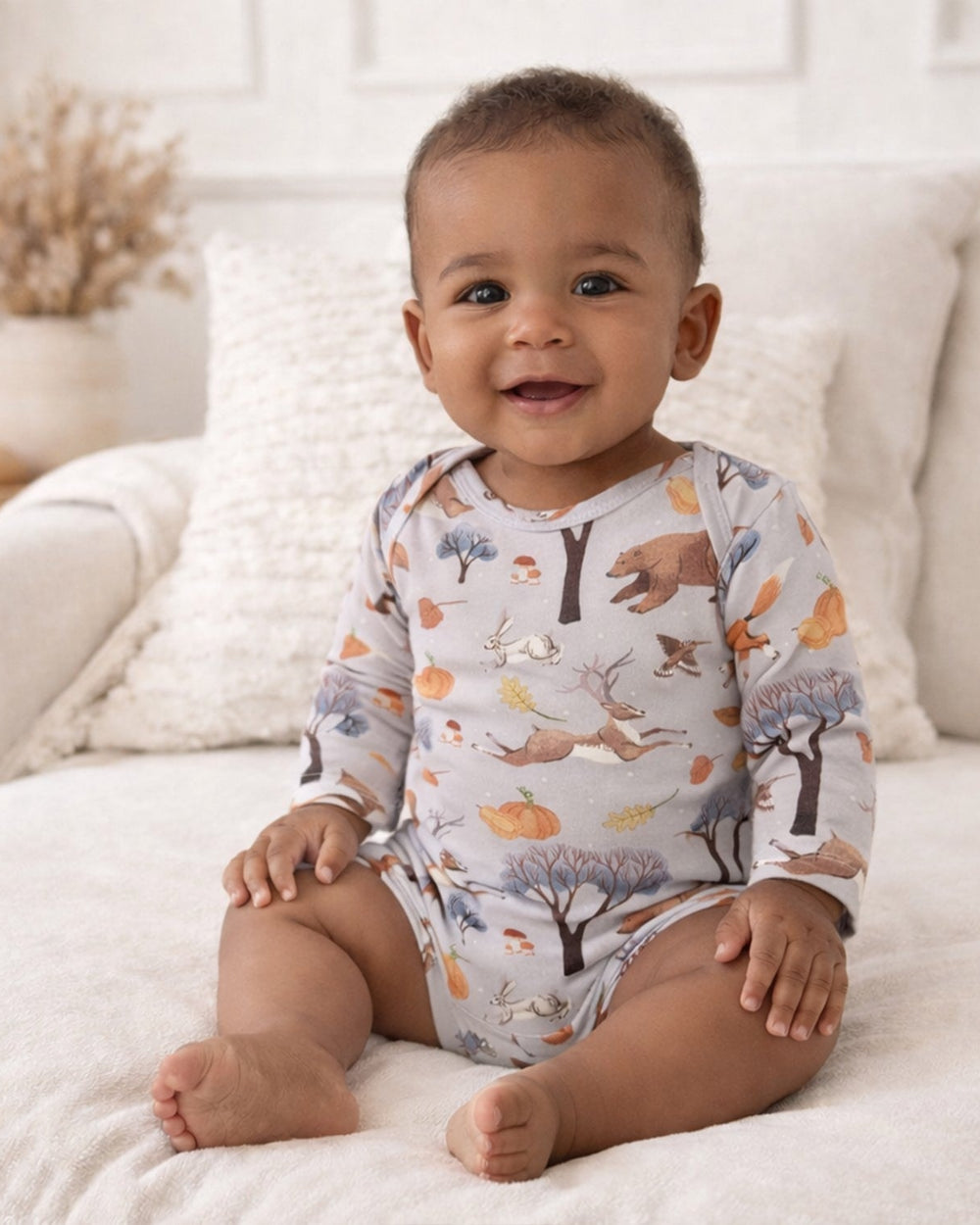 Baby long-sleeve bodysuit in light blue with woodland animal and pumpkin print