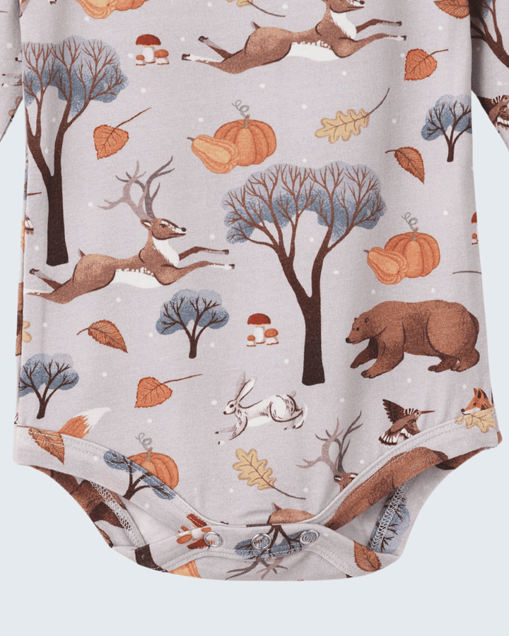 Light gray baby bodysuit with woodland print and snap-button bottom