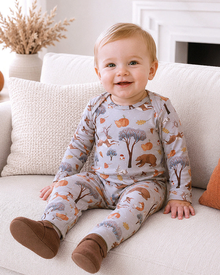 Woodland-print baby footed romper with long sleeves, slip-on style