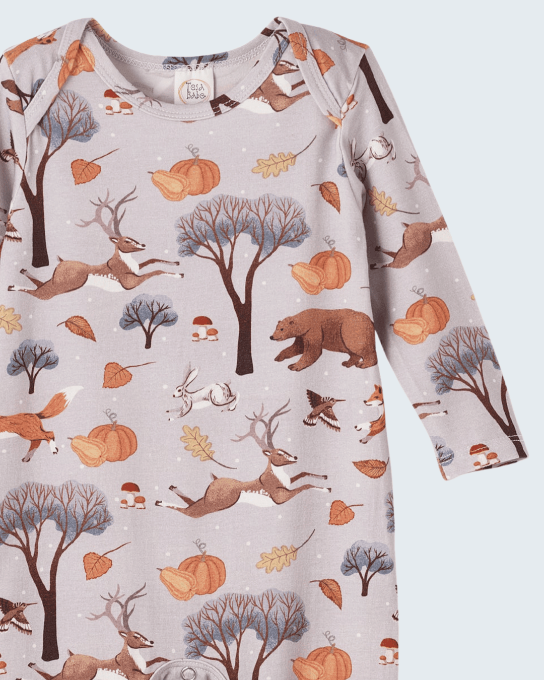 Bamboo romper close-up: crew neck with snaps and forest animal fall print.
