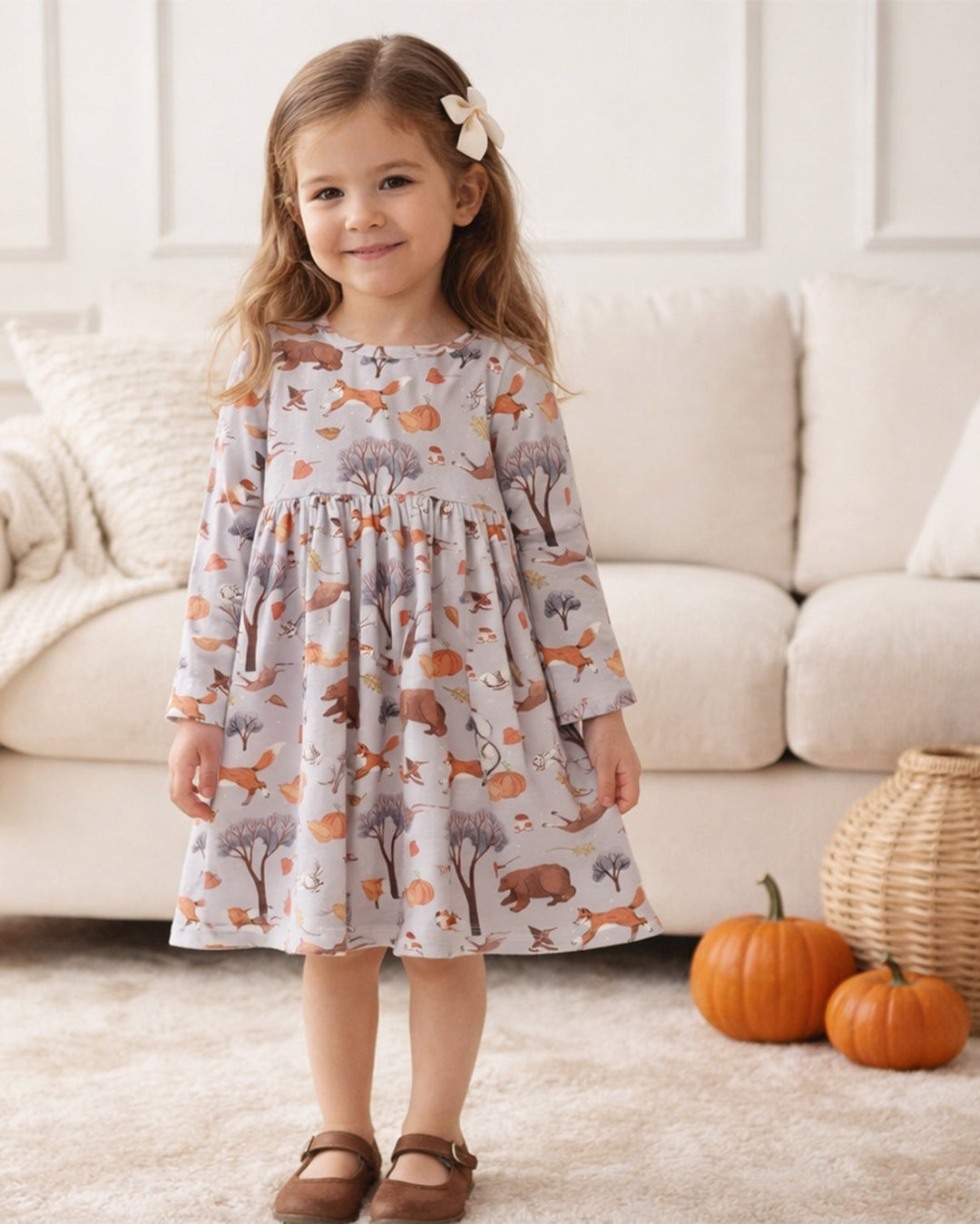 Girls twirl dress with long sleeves, gathered skirt, woodland animal print and round neckline