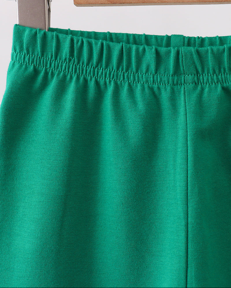 Forest green ruffle leggings with elastic waistband and vertical seam detail