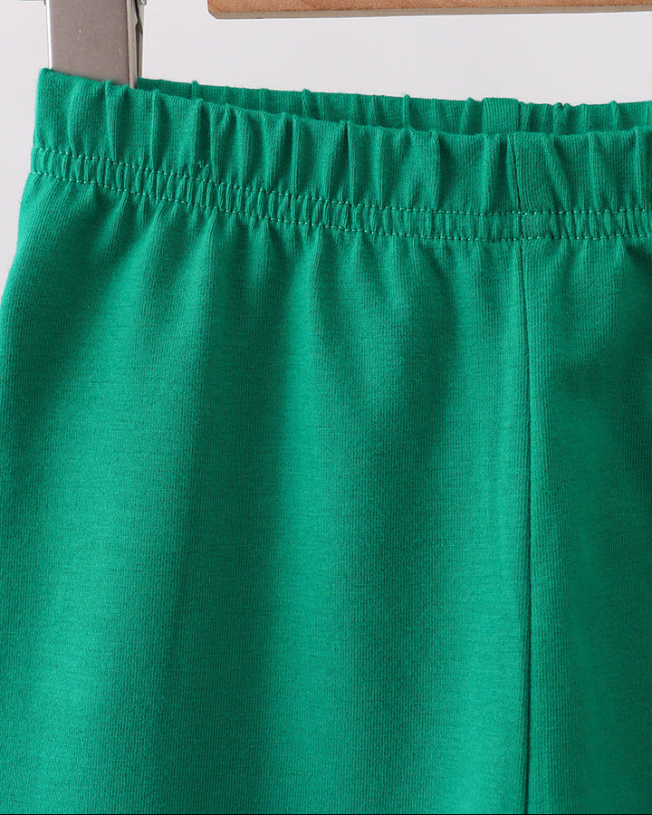 Forest green ruffle leggings with elastic waistband and vertical seam detail