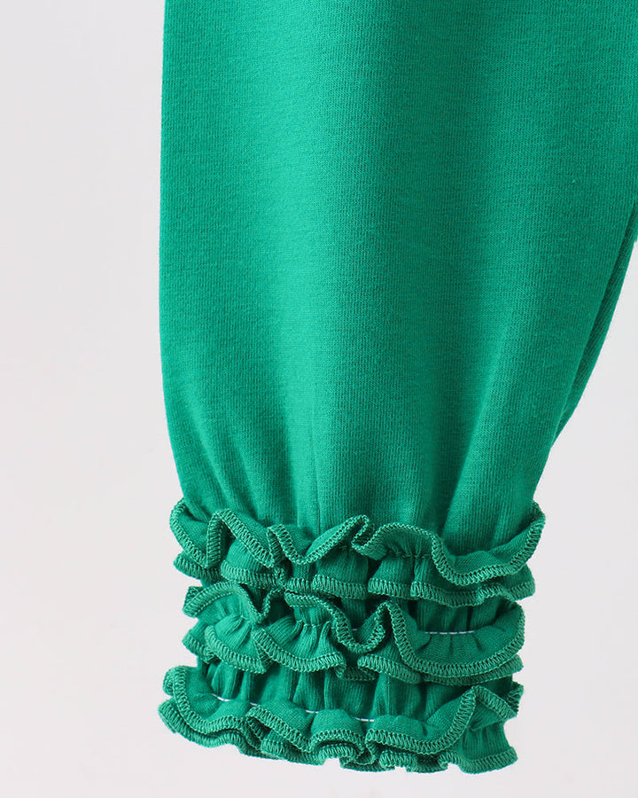 Forest green leggings with layered ruffle cuffs at the ankles