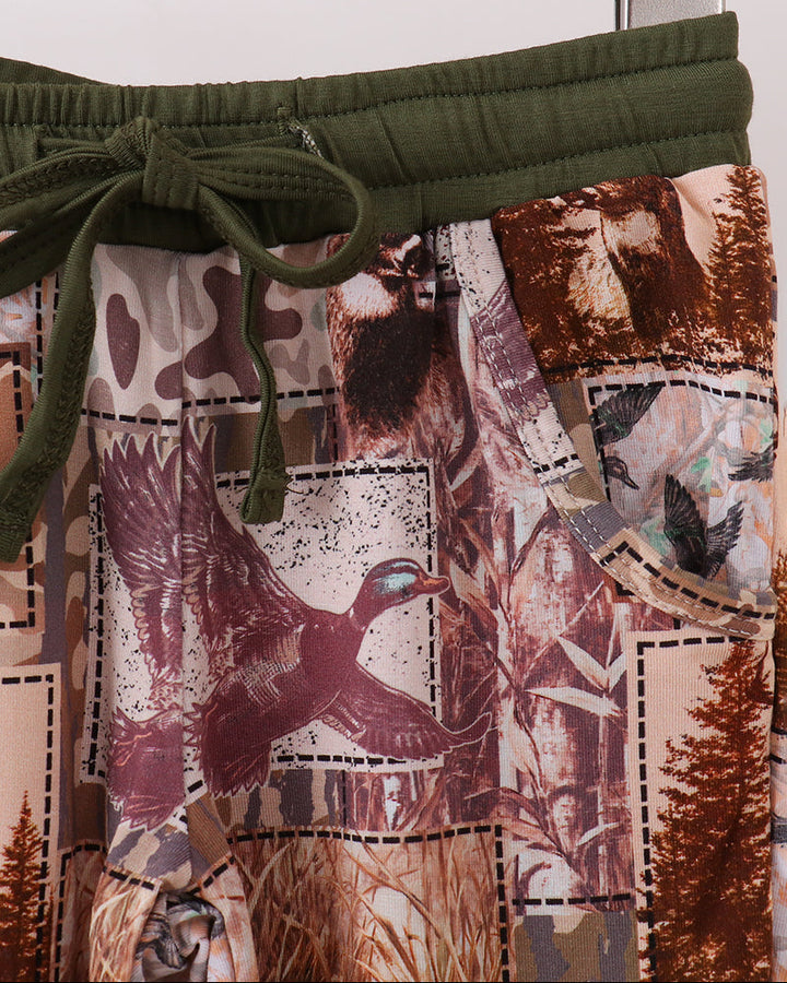 Woodland-print pajama pants with elastic waist, drawstring, and olive cuff