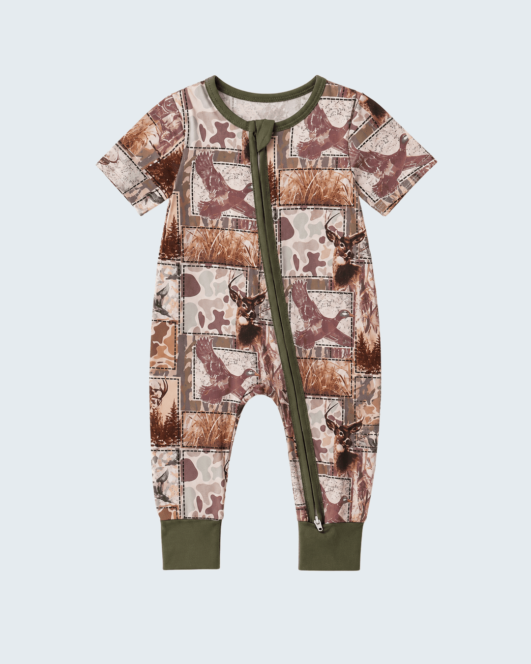 A baby short-sleeve footless one-piece romper with an allover patchwork print of brown deer and woodland camouflage motifs, featuring olive green trim, a front zipper, and ribbed cuffs.