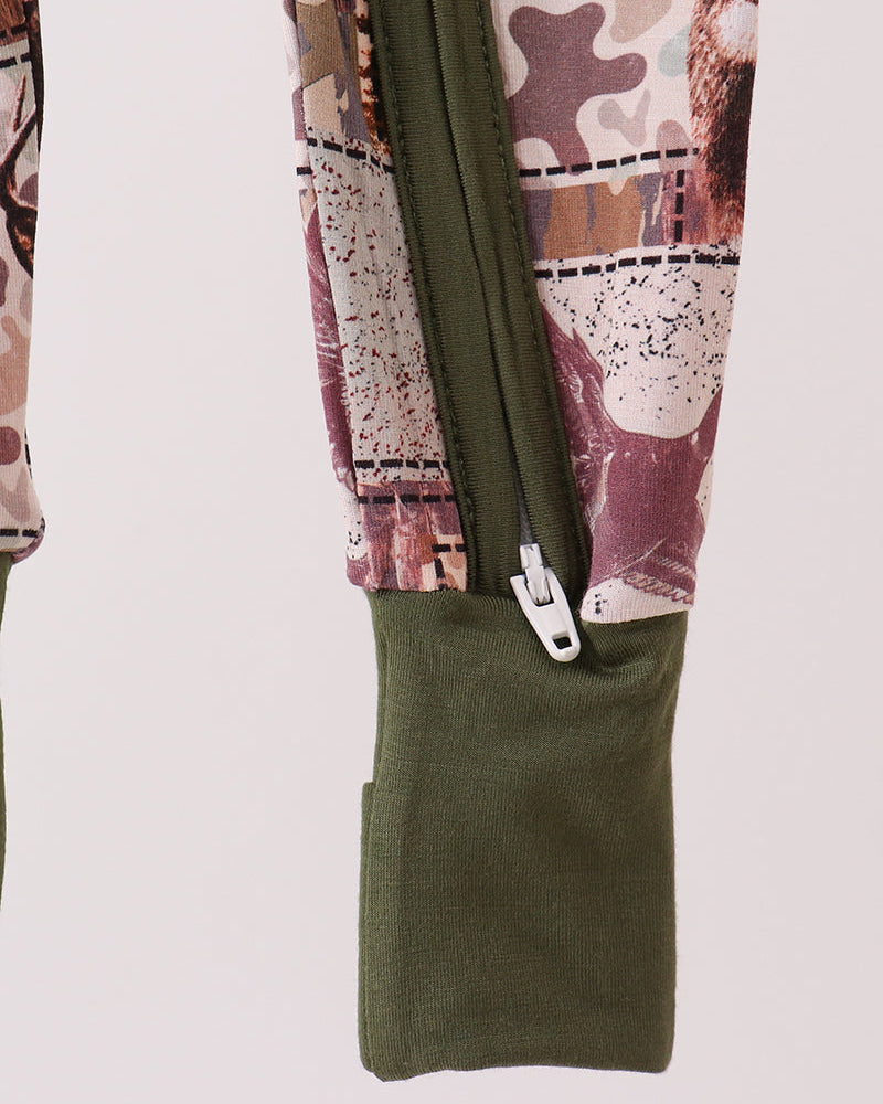 Camouflage romper side view with olive green bib pocket and front zipper tab