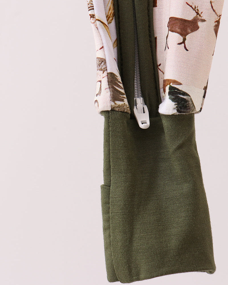 Bamboo romper with olive-green front zipper and wildlife camo pattern