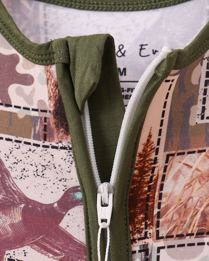 Camouflage bamboo romper with olive V-neck style and white zipper pull detail