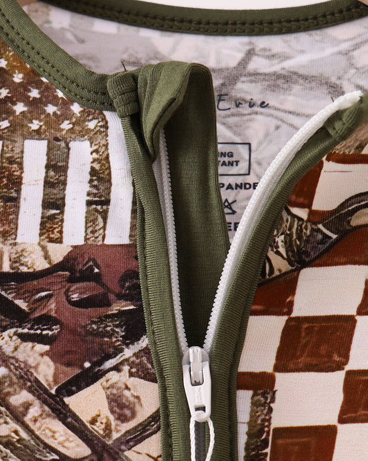 Olive-green front zipper detail on animal print bamboo romper with gathered neck