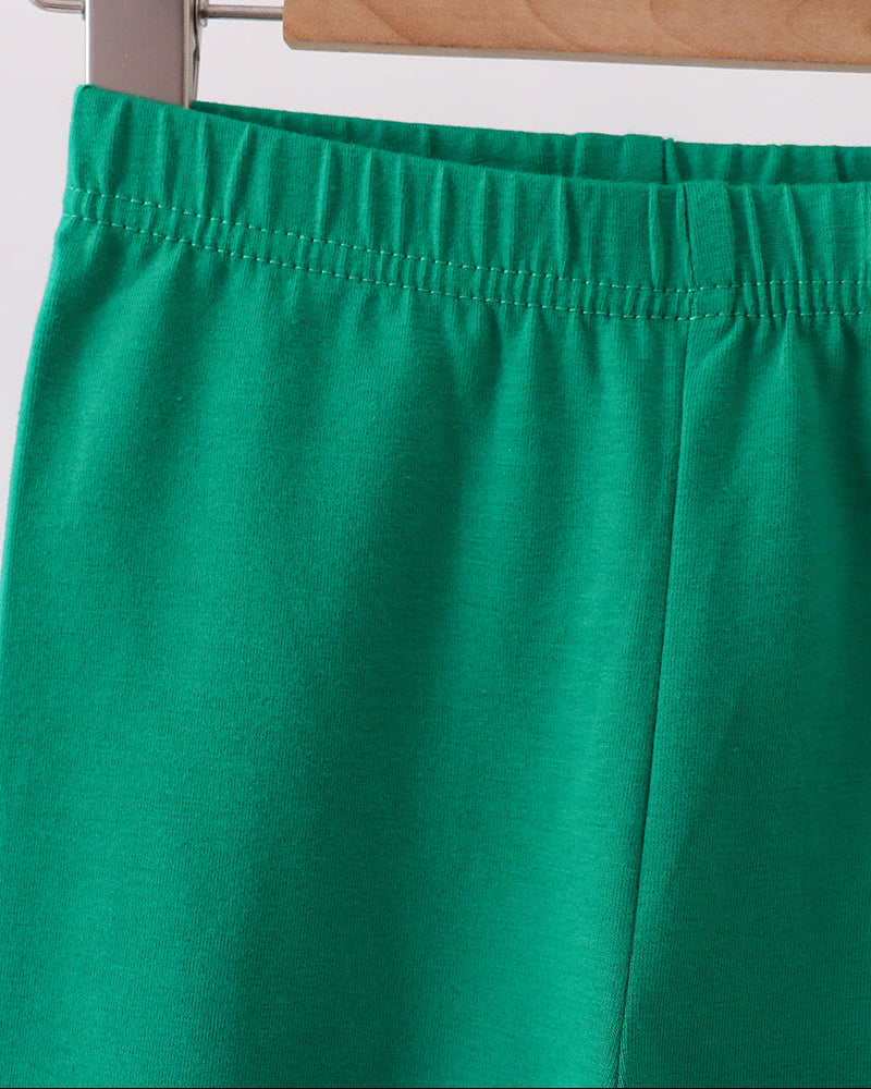 Green ruffle leggings with elastic waistband and flared cuff hems.