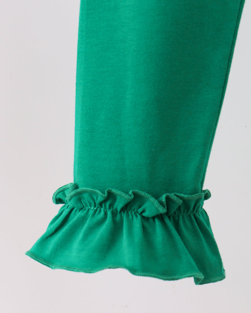 Green leggings with gathered ruffle cuff hem at the ankle.