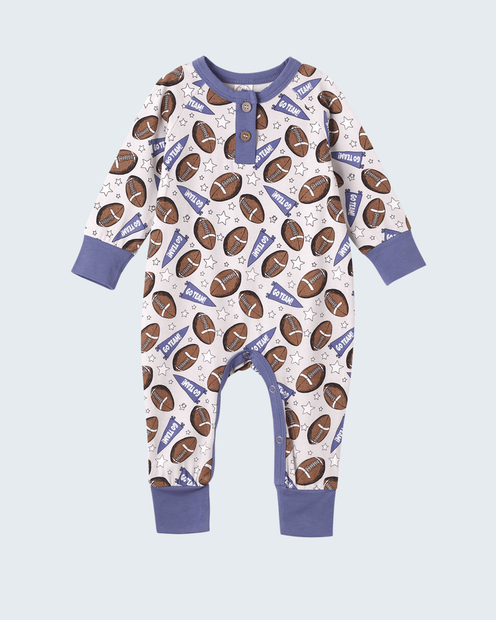 Football-themed bamboo romper with long sleeves, white base, football and star print, snaps