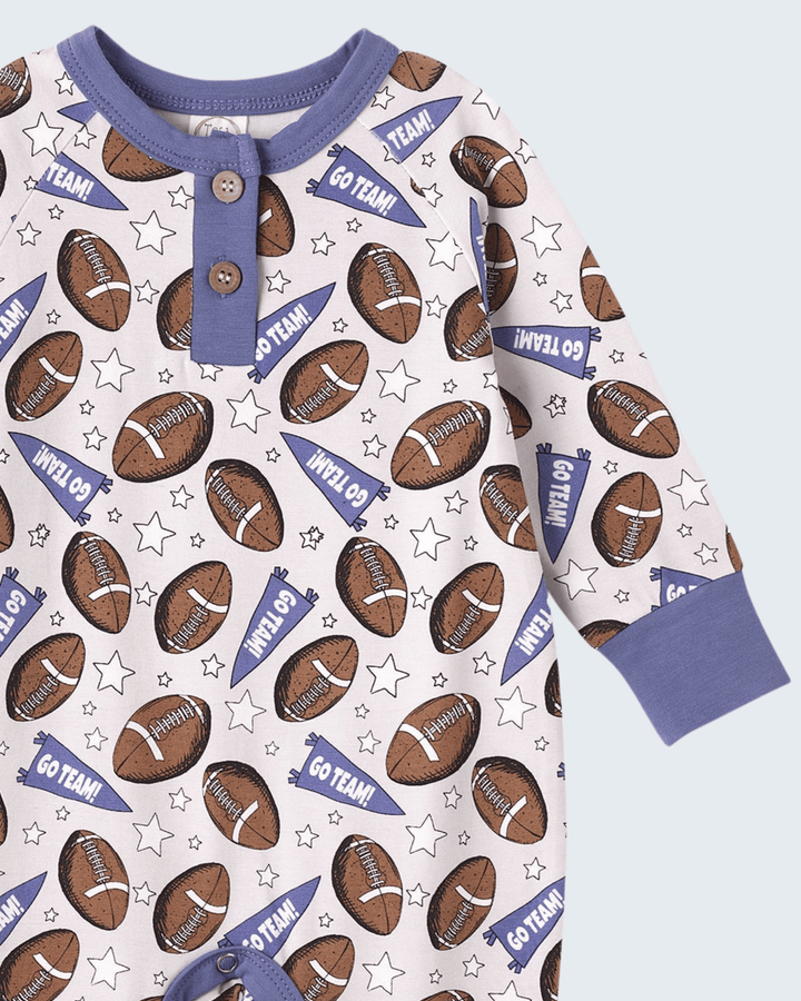 Bamboo romper with football and star pattern, purple collar, two-button placket, long sleeves