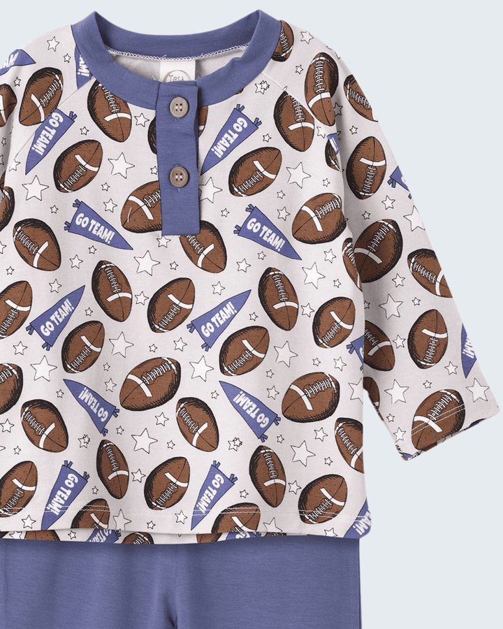Football henley shirt with snap placket, stars, and blue collar