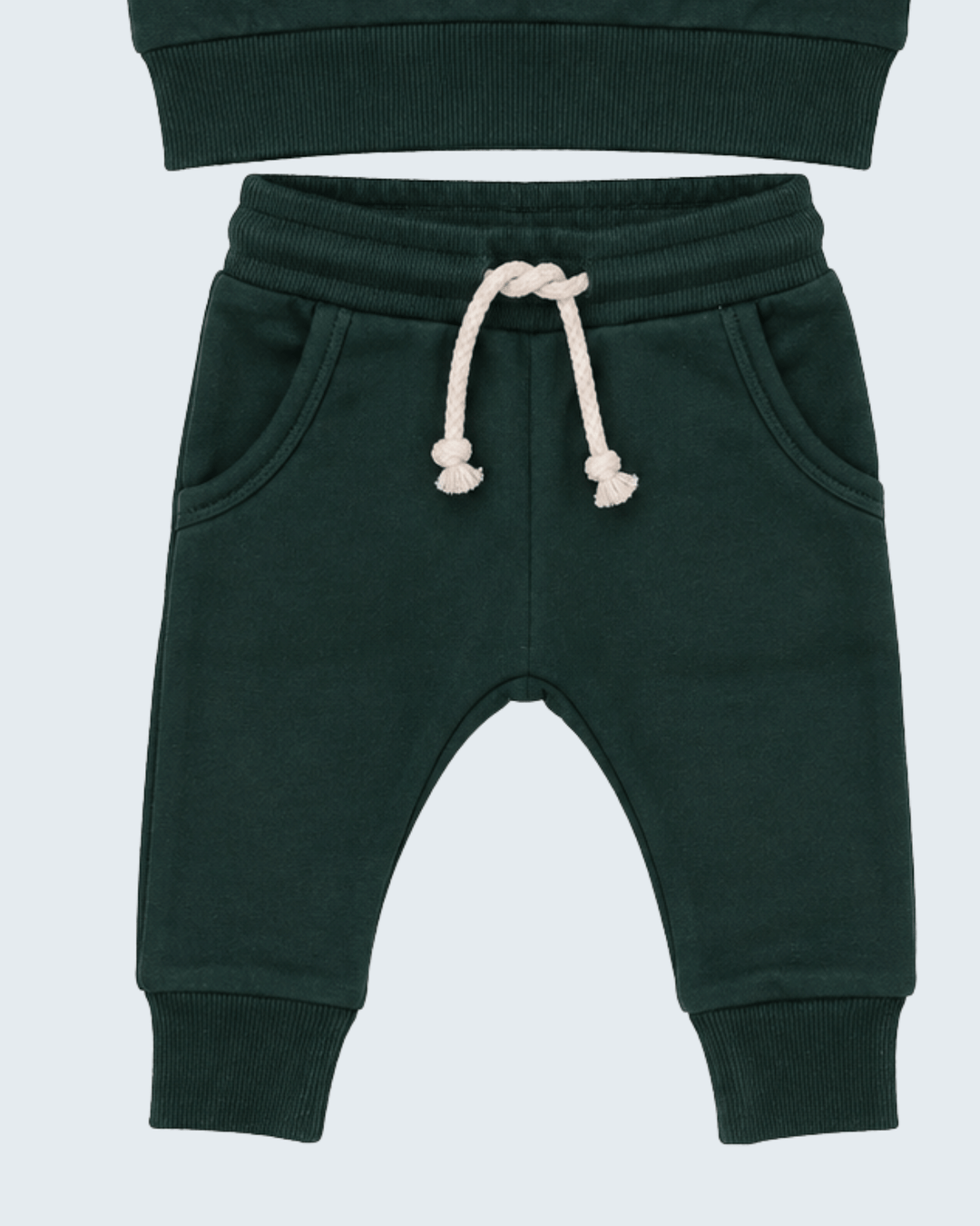 Dark green jogger pants with elastic cuffs and white drawstring waistband