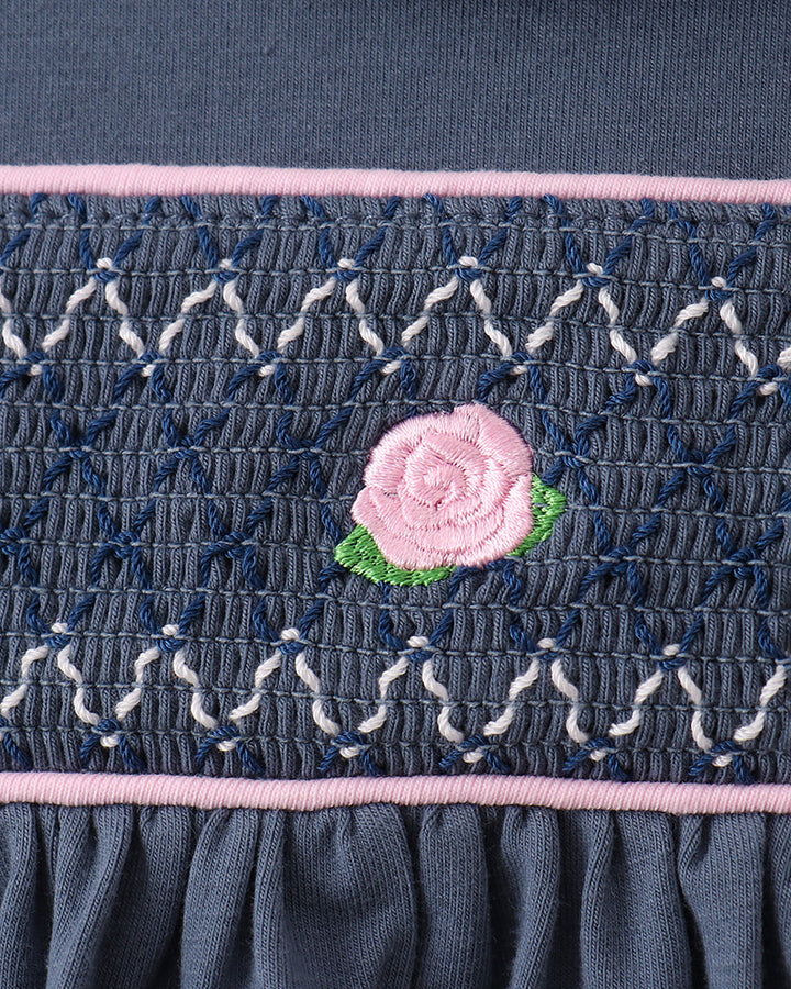 Navy smocked bloomer with pink flower applique and pink-trim elastic waistband