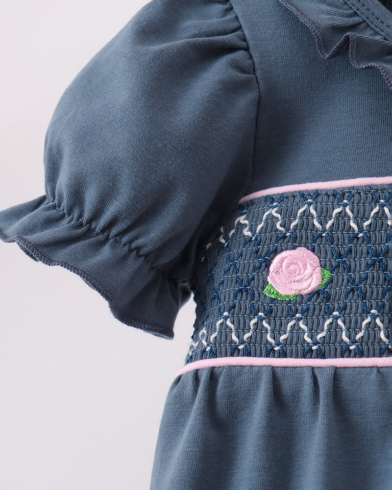 Navy smocked ruffle bubble with puff sleeve and pink rose embroidery