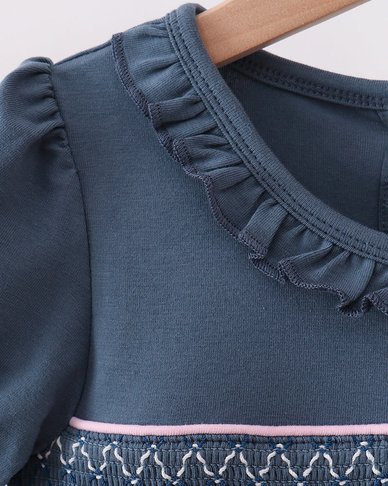 Blue dress neckline with ruffled collar and smocked yoke detail
