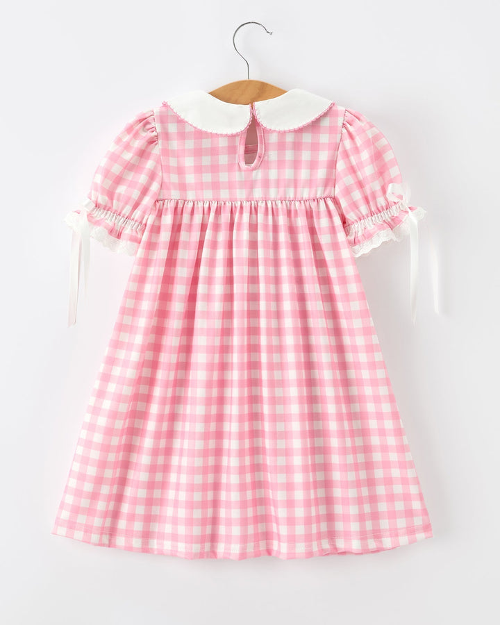 Girls pink gingham dress with Peter Pan collar, puff sleeves, and ruffled hem