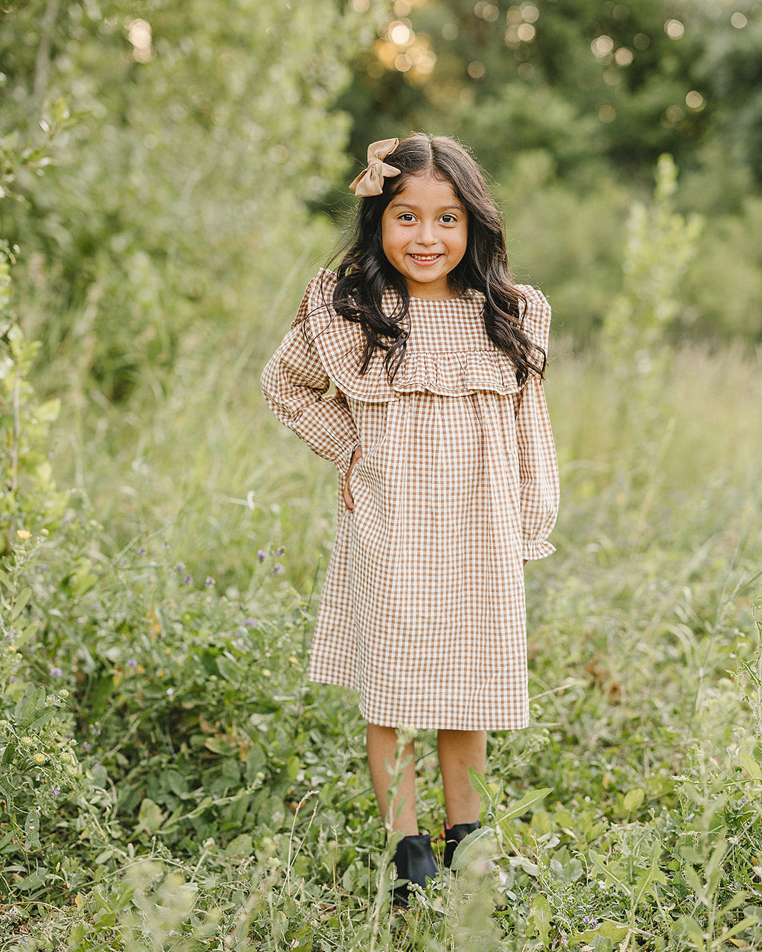 Tan and brown gingham ruffle dress with flared skirt and long sleeves