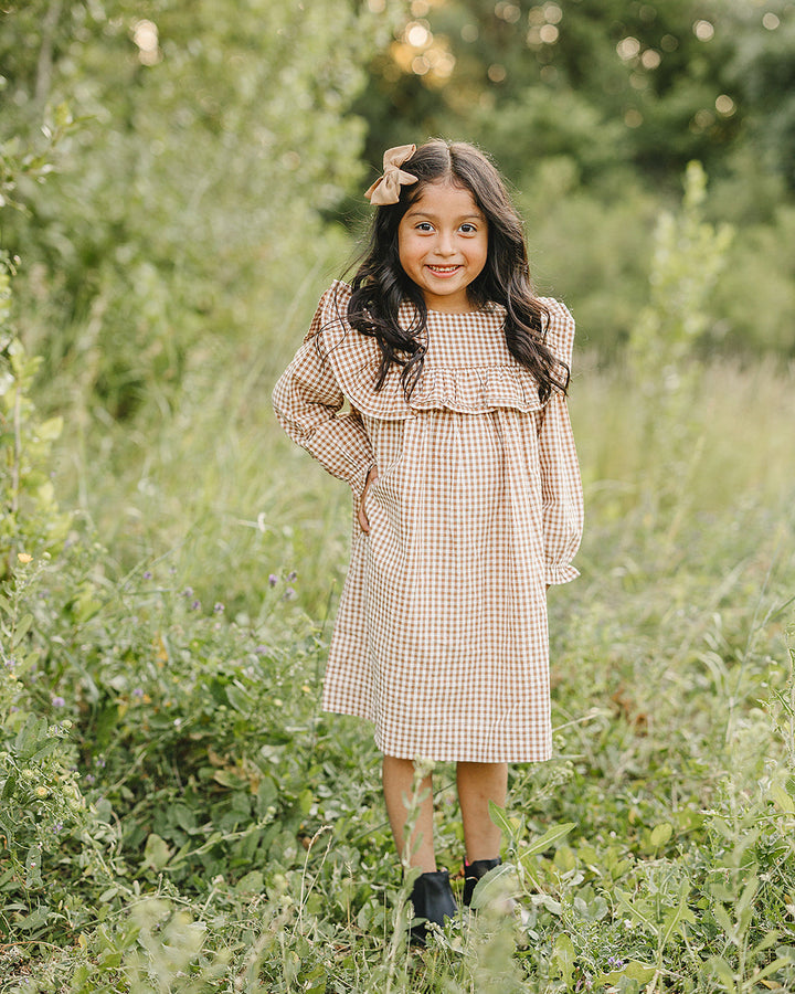 Tan and brown gingham ruffle dress with flared skirt and long sleeves