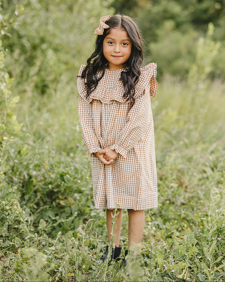 Tan and brown gingham ruffle dress with layered neck ruffle and long sleeves