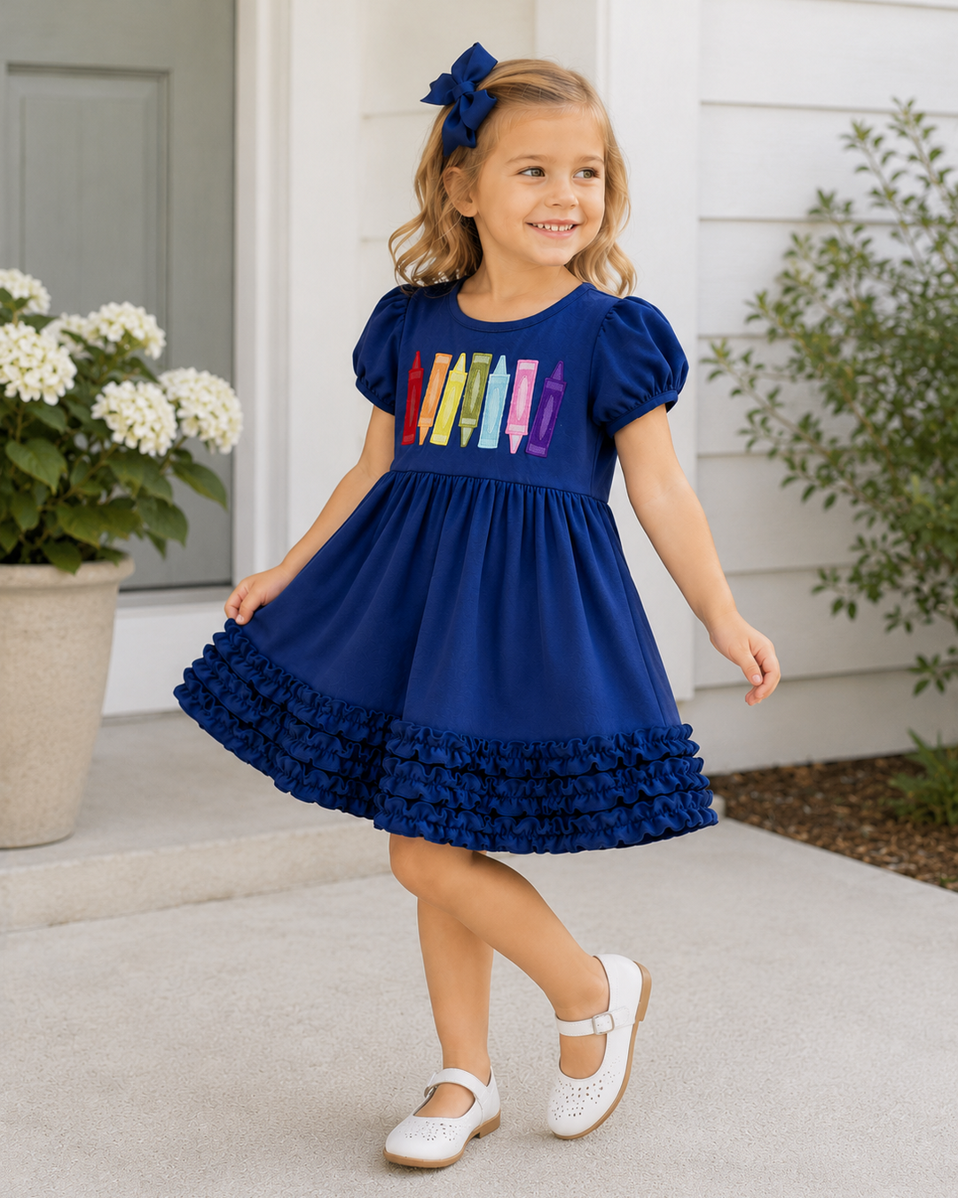 Young girl in blue back to school dress standing on porch