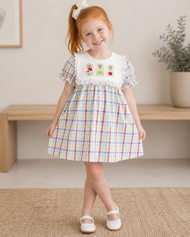 Young girl in plaid dress for back to school
