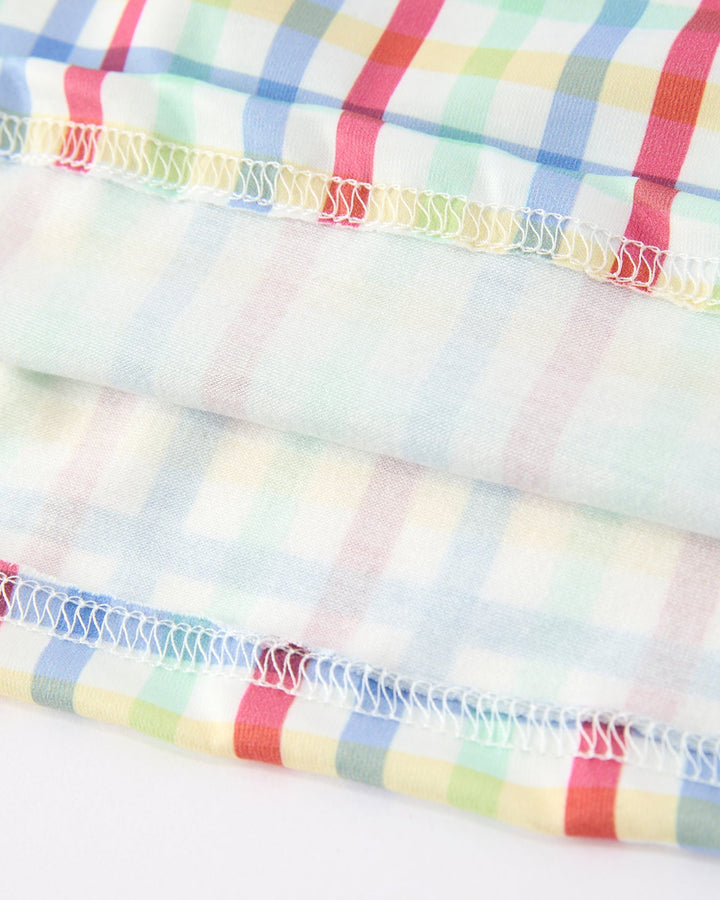 Close-up of colorful plaid fabric with a white background