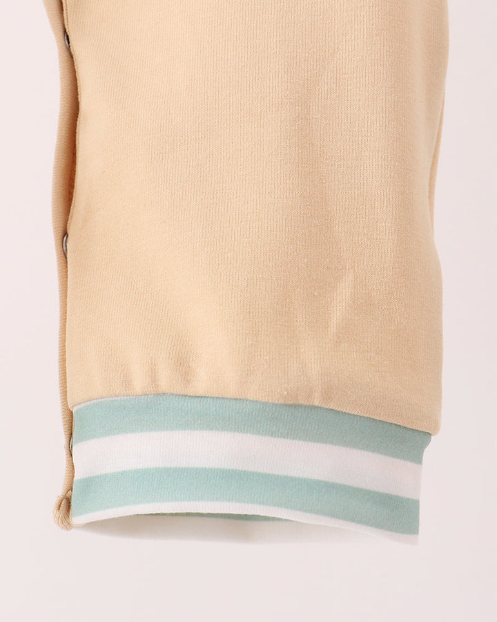 Beige romper leg opening with light blue striped band trim