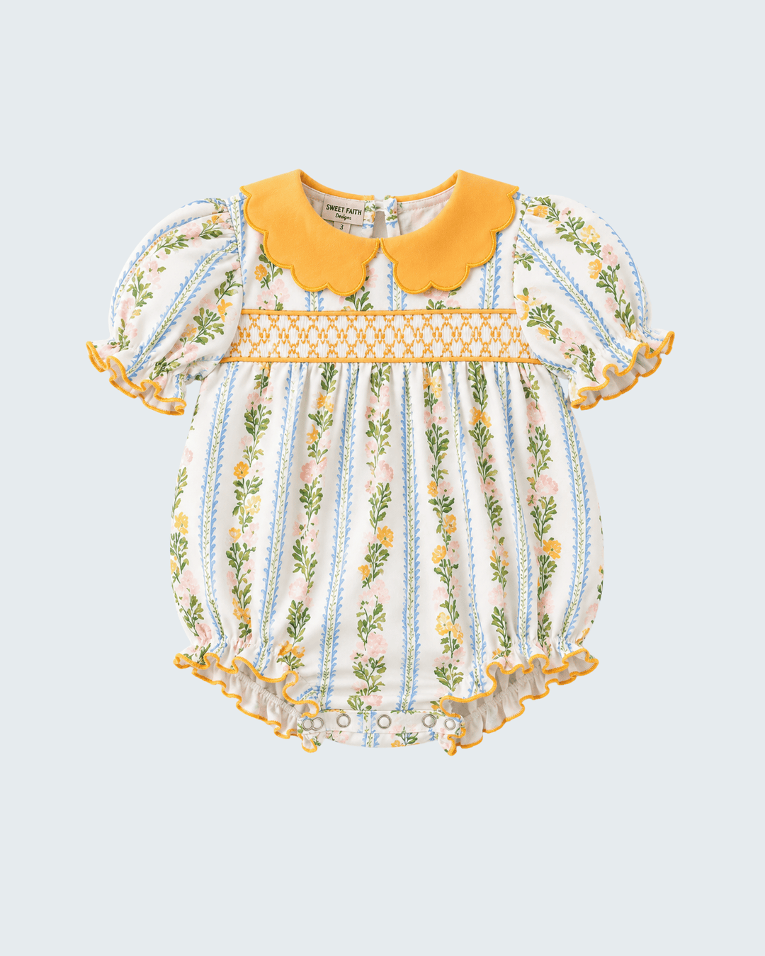 Golden floral smocked romper with scalloped yellow collar and gathered short sleeves
