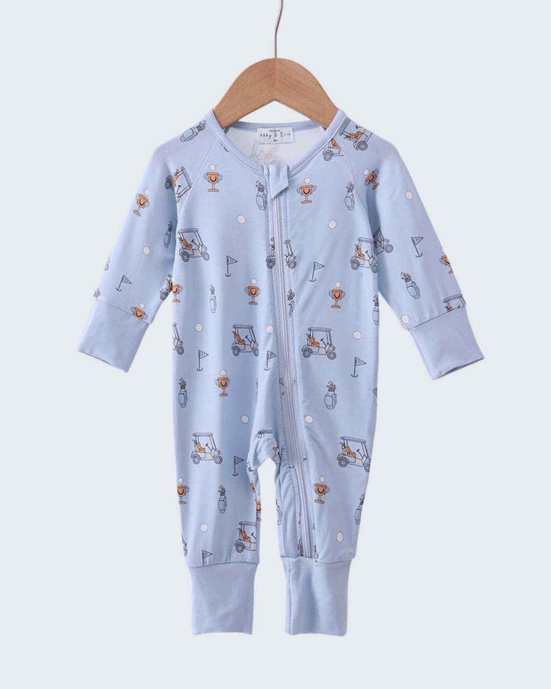 Blue baby onesie with patterns on a white background