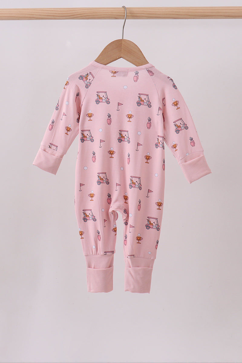 Pink baby onesie with car pattern on a hanger against a light gray background