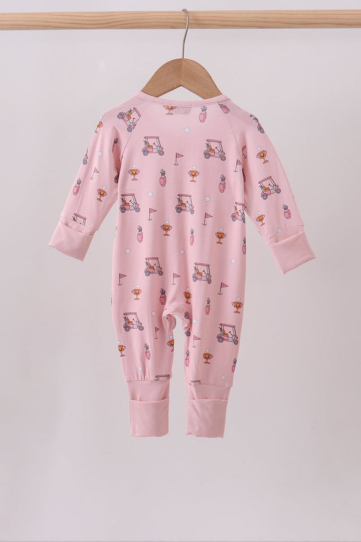 Pink baby onesie with car pattern on a hanger against a light gray background