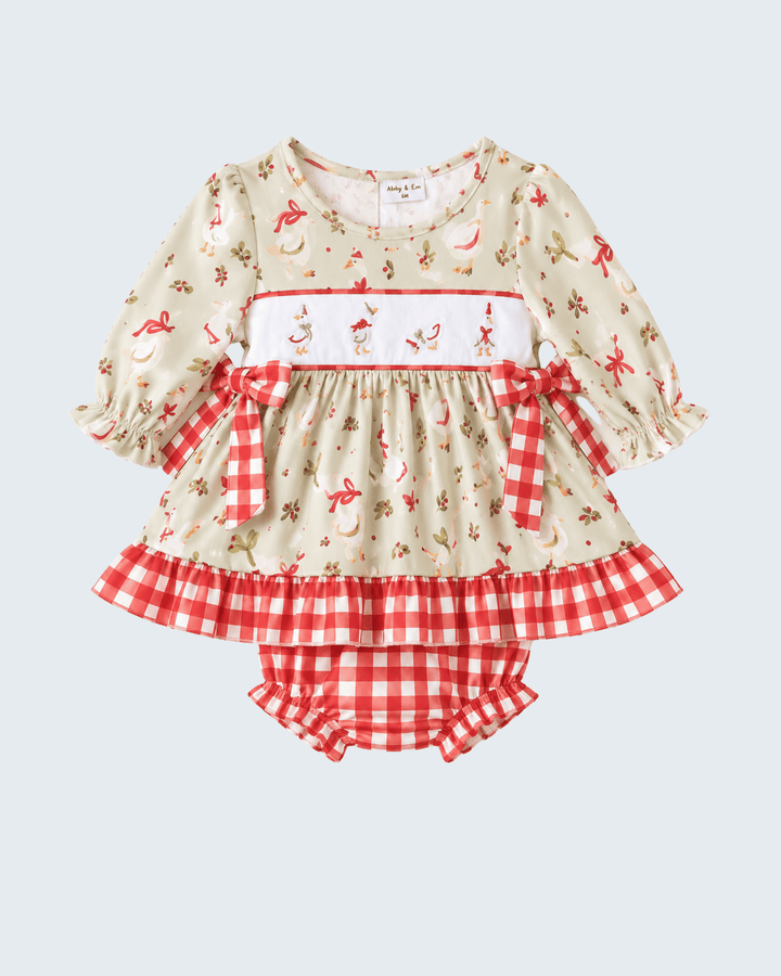 Cream baby bloomer set with long-sleeve ruffle top, red animal print, and gingham bottoms